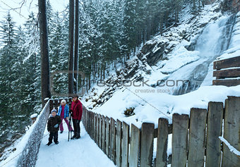 Alps waterfall winter view and family