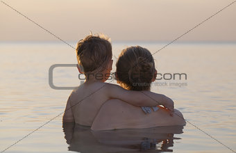 Mother and son watching the sunset