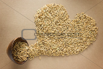 Paddy in heart shape on brown background