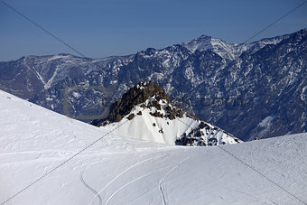 Trace from ski and snowboards on off-piste slope