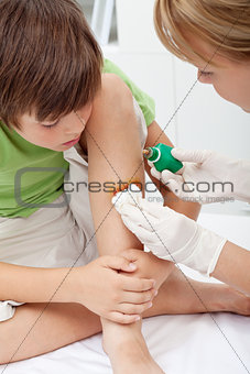 Taking care of a little boy leg injury