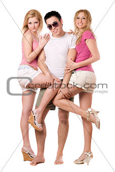 Smiling young man and two playful girls
