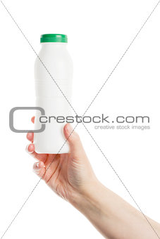 Hand holding plastic bottle