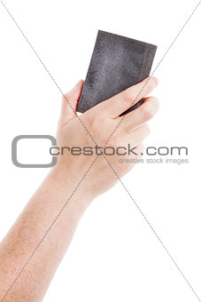 Female hand holding sanding sponge
