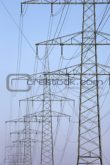 Electricity pylons in a row