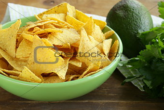 corn chips (nachos) in a green bowl