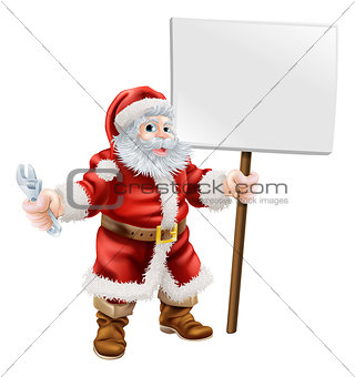 Santa holding spanner and sign