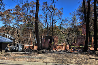 After the fire - burned houses and vehicles