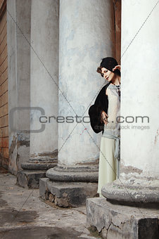Retro styled fashion portrait of a young woman. Clothing and mak