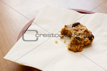 Oatmeal raisin cookie with a bite taken