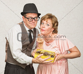 Husband Holding Candy for Pregnant Woman