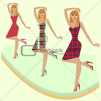 Fashion models posing on podium in various checkered dresses
