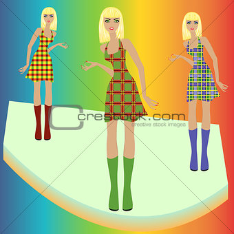 Fashion blond models posing on podium in checkered dresses