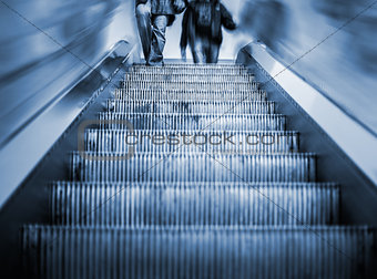 Underground Escalator with motion blur and blue tint