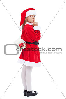 Girl in santa costume preparing a surprise