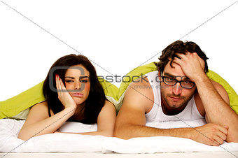 Beautiful couple in bed under a green duvet