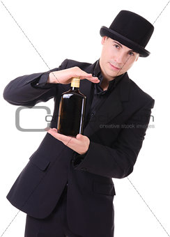 Retro stylish man in black suit with bottle of drink 