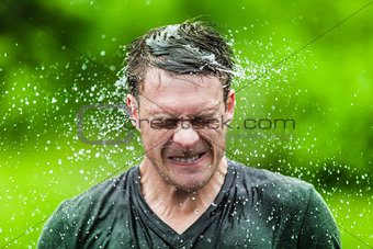 Young Adult Completely Drenched Shaking His head