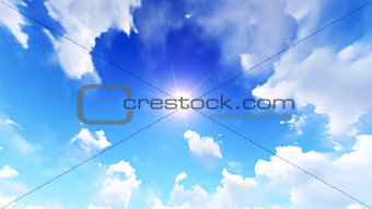 Sun in the blue cloudy sky
