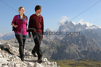 Young couple hiking in the mountains