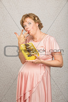 Expecting Woman Eating Candy