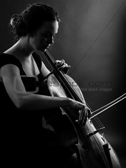 Female playing the cello black and white