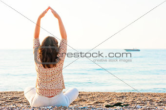Pilates girl has sat on the beach