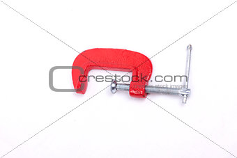 Red clamp on a white background
