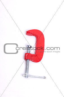 Red clamp on a white background