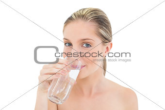 Lovely fresh blonde woman drinking water