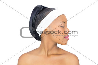 Serious woman with closed eyes looking aside