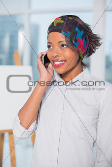 Attractive artist talking on phone