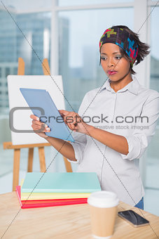 Focused artist using tablet