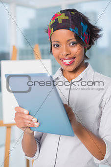 Happy artist using tablet