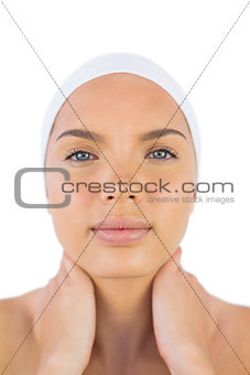 Woman wearing a headband suffering from painful neck