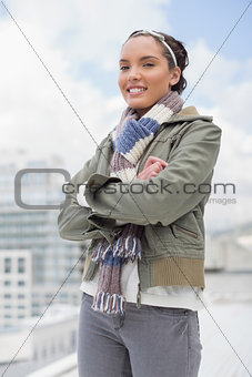 Portrait of smiling woman crossing her arms