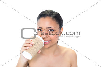 Cute young dark haired model drinking coffee