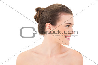 Attractive smiling woman looking aside