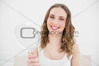 Pretty woman holding a mirror