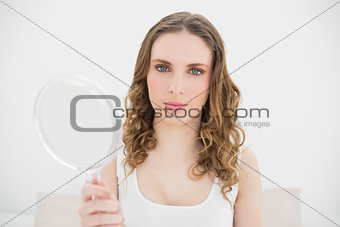 Woman holding a mirror