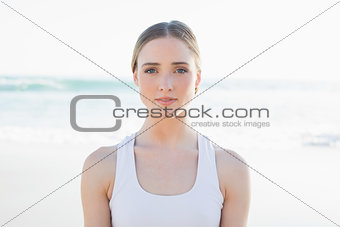 Beautiful young woman sitting on the beach