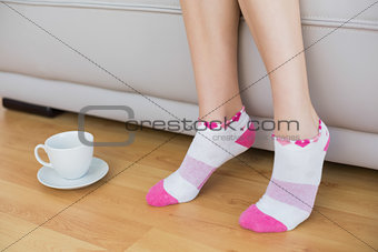Young slender woman wearing pink socks