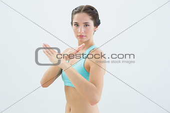 Portrait of a fit woman standing in defending position