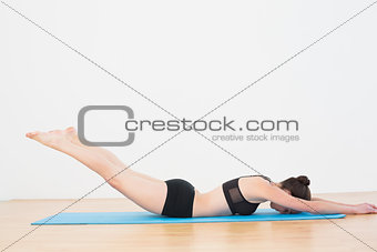 Sporty woman doing the Locust Posture