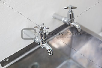 Two taps and stainless steel kitchen sink