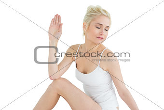 Toned woman in Ardha Matsyendrasana position