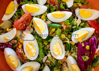 Spring salad of tomatoes, corn, scotch kale, eggs dressed with o