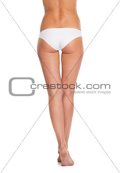 Closeup on legs of young woman in lingerie