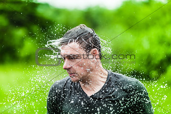 Young Adult Completely Drenched Shaking His head
