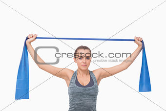 Young woman training using a resistance band